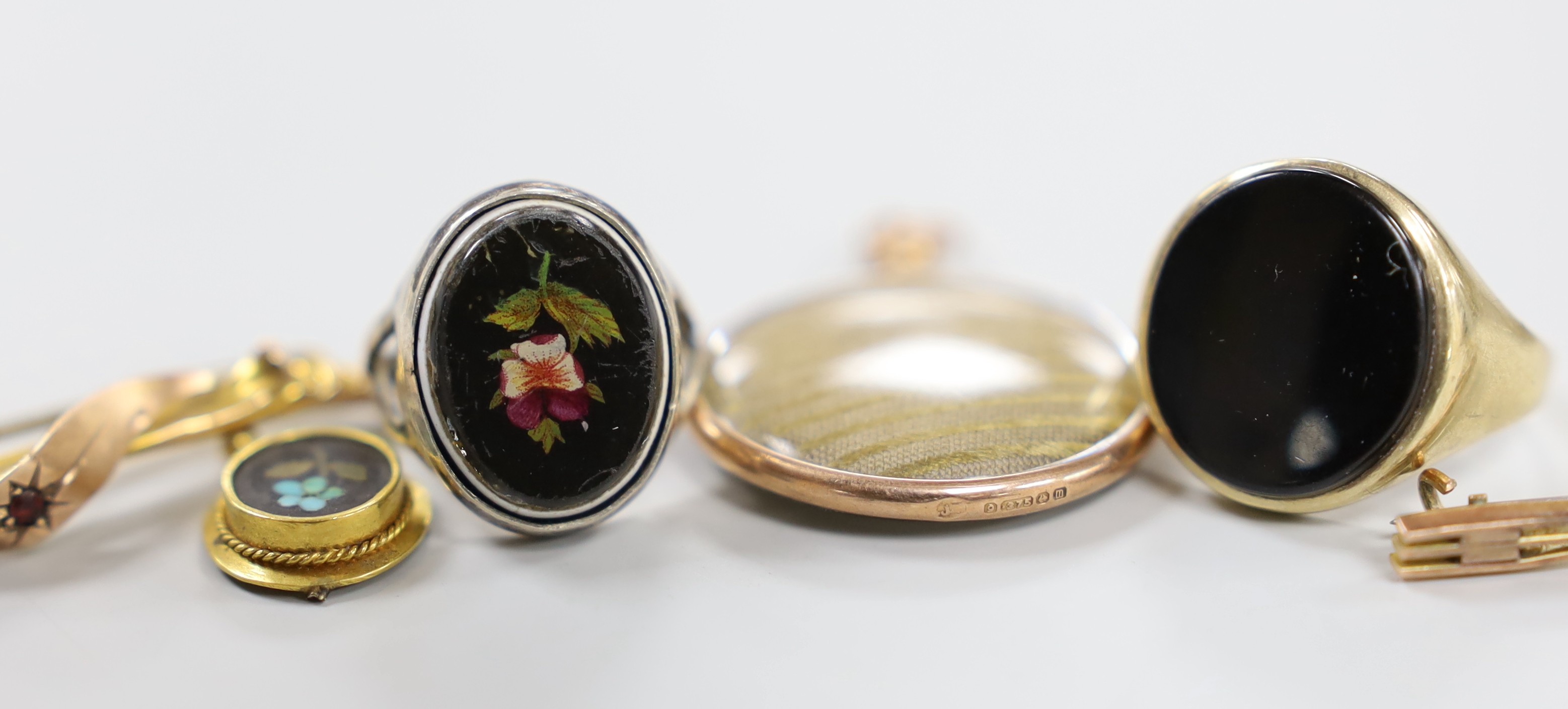 A Victorian yellow metal mounted rock crystal fob seal, 21mm, two yellow metal bar brooches including 9ct gold, an Edwardian Art Nouveau 9ct gold and white opal set scroll brooch by Charles Horner and four other items in